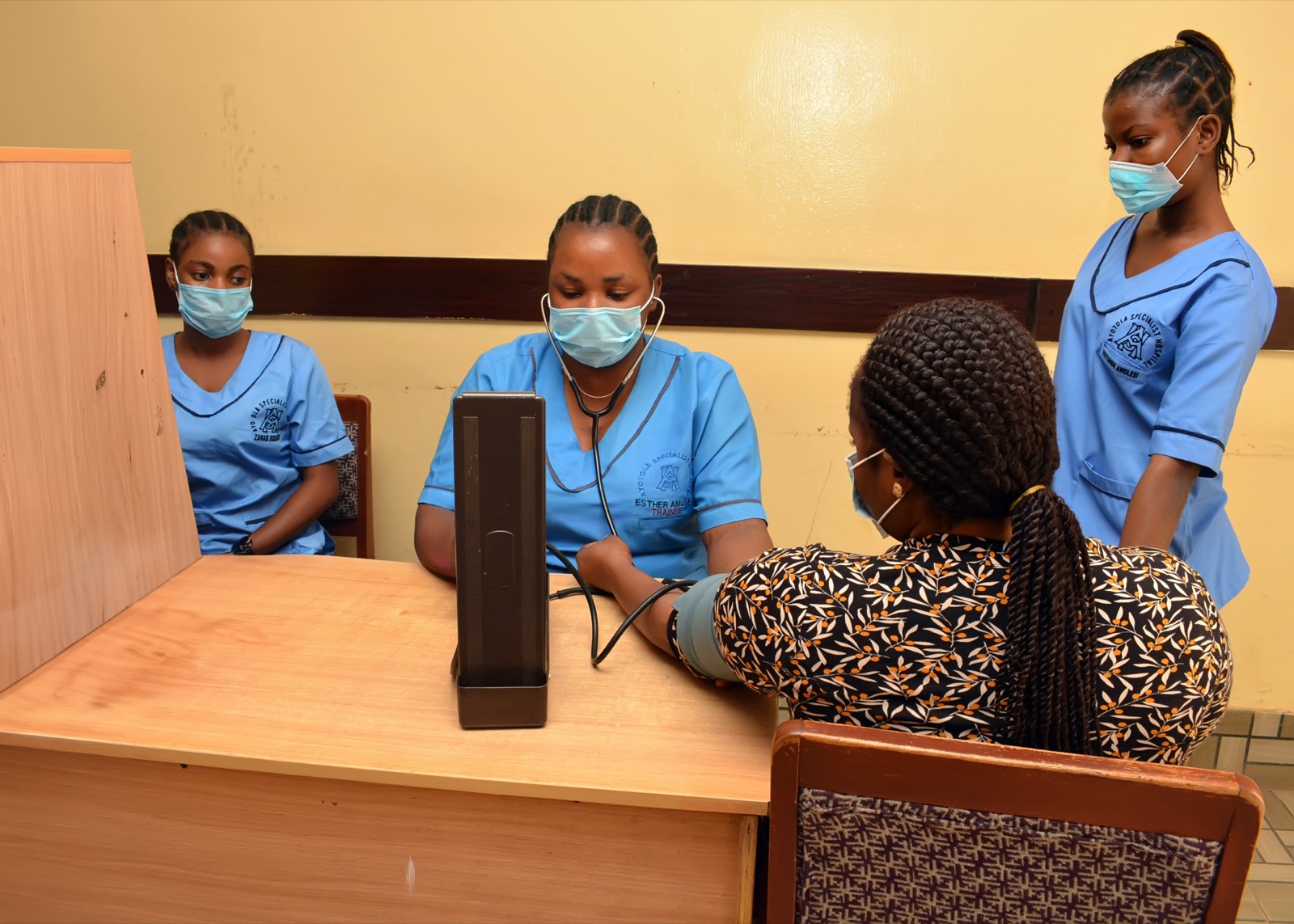 Nurses taking blood pressure at Ayotola Specialist Hospital